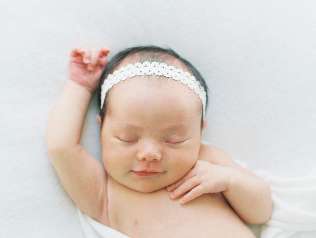simple newborn photo with white headband
